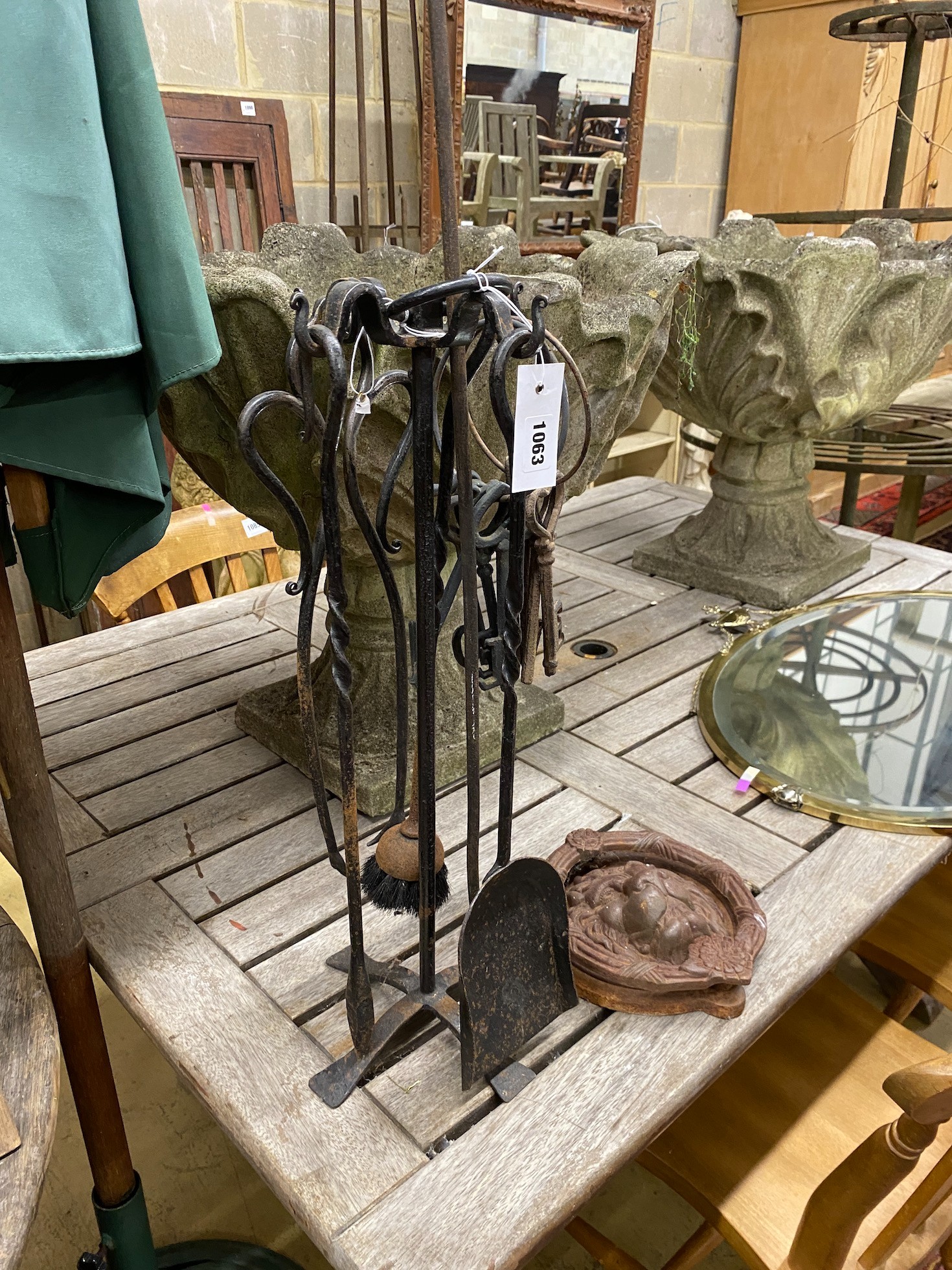 A fire companion set, a cast iron lion's mask door knocker and a group of metal keys